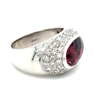 Estate pink tourmaline diamond ring on hand scale view