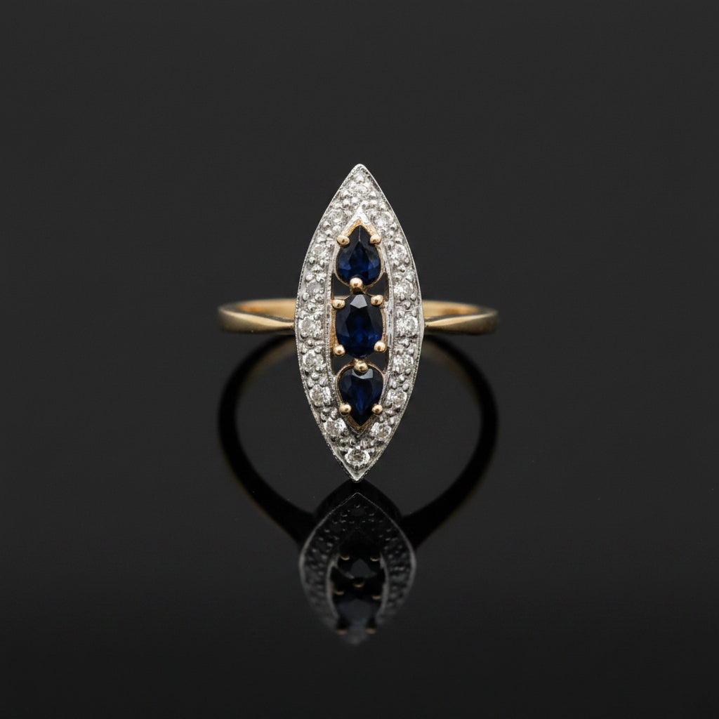 Estate jewelry — A Trio of Sapphires, in Two-Tone Gold, three pear-shaped sapphires in two-tone 14K gold