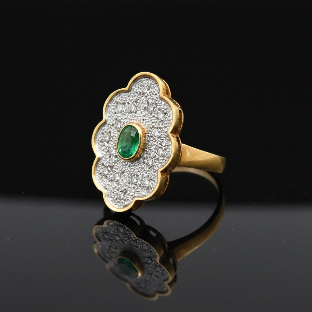 Estate jewelry — An Emerald, Set Beneath a Gold Flower, 0.20 ctw diamonds