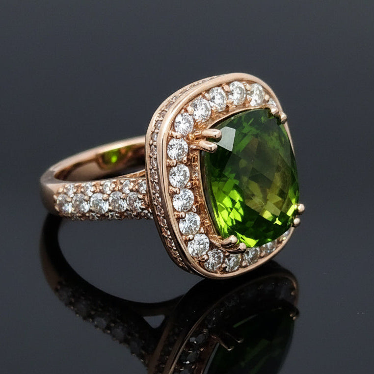 Estate jewelry — A Peridot Ring, Cushion Cut, in Yellow Gold, 10.30ct cushion-cut peridot with diamond halo in 14K yellow gold