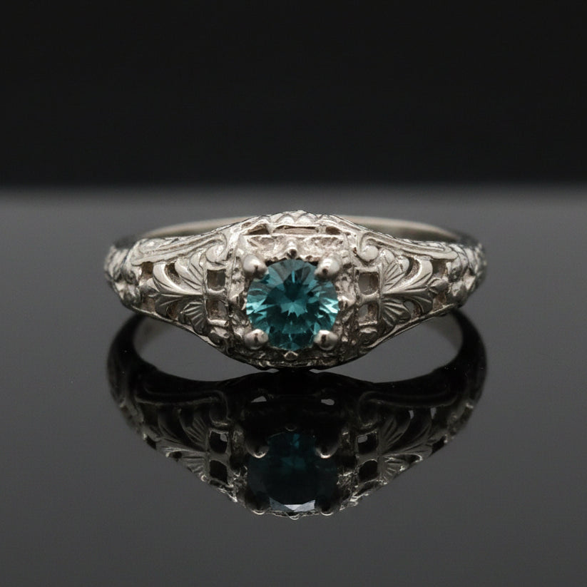 Estate jewelry — An Irregular Blue Diamond, in Scrolled White Gold, 0.30 ctw diamonds