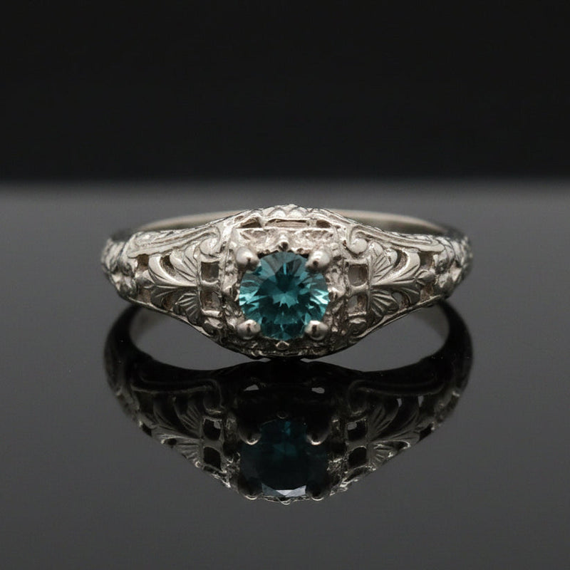 Estate jewelry — An Irregular Blue Diamond, in Scrolled White Gold, 0.30 ctw diamonds