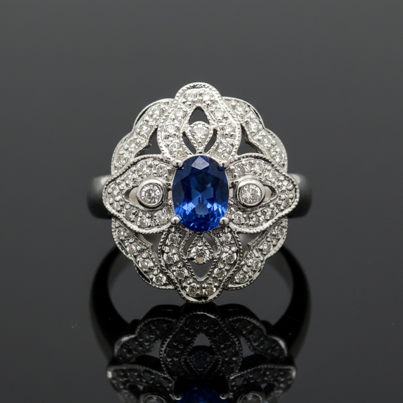 Estate jewelry — A Sapphire and Diamond Ring, in White Gold, sapphire and diamond halo in 14K white gold