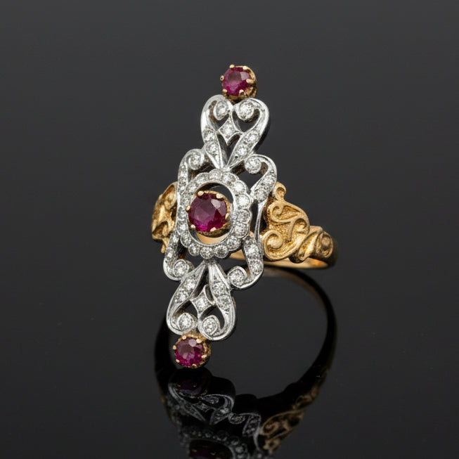 Estate jewelry — A Scroll, Warmed by Rubies, ruby and diamond ring in 18K two-tone gold, 0.50 cttw rubies