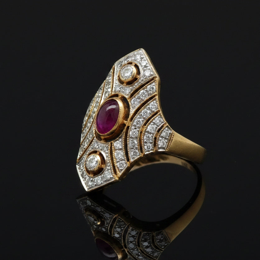 Estate jewelry — A Cabochon, Set in Contrast, cabochon ruby and diamond ring in 18K two-tone gold, 0.81 cttw ruby