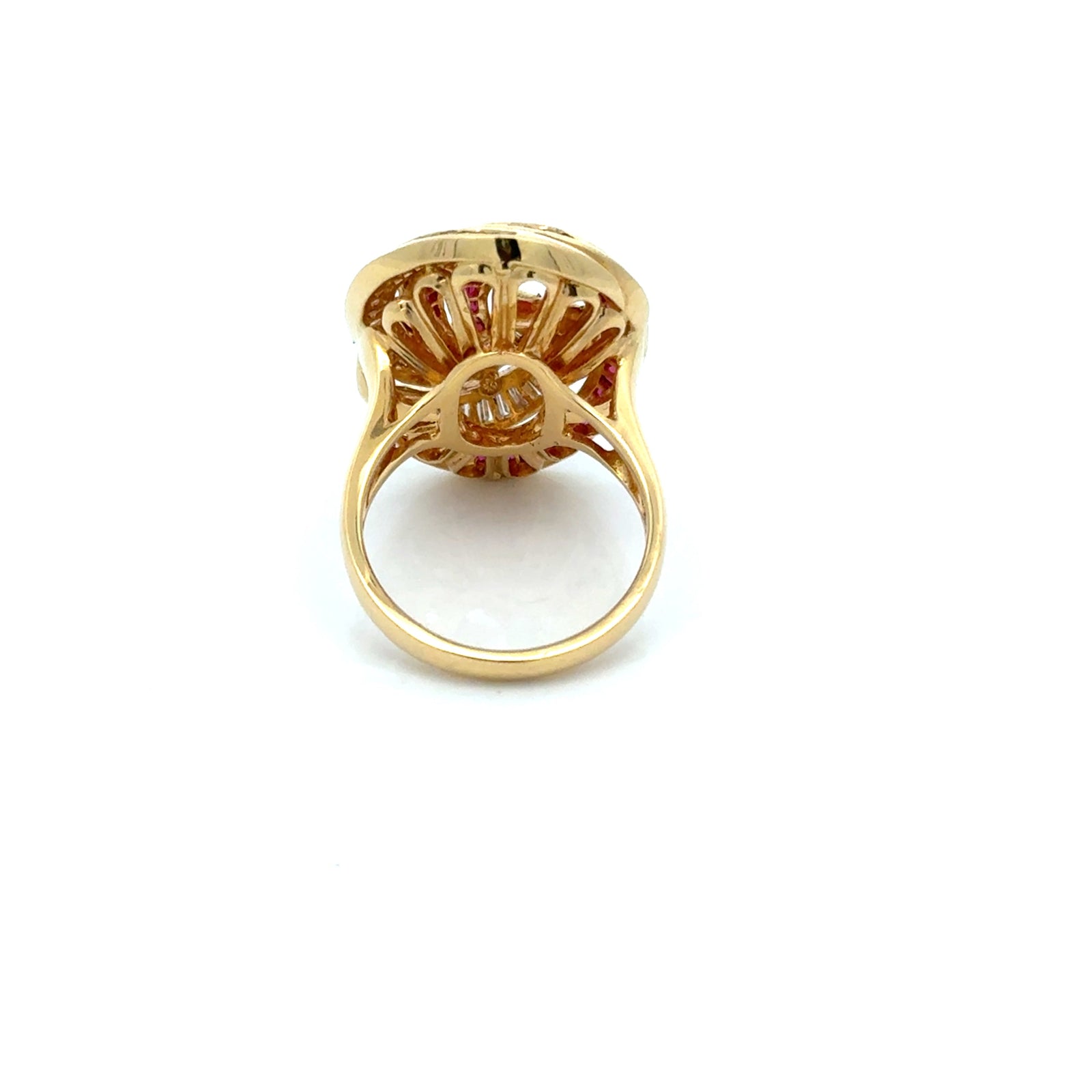 Estate jewelry — A Swirl, Set in Baguettes, baguette ruby and diamond ring in 18K yellow gold, 0.83 cttw diamonds