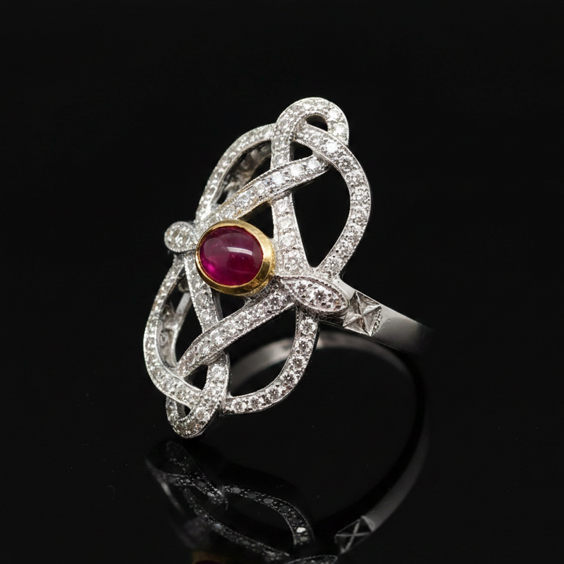 Estate jewelry — A Cabochon Ruby, in Ribbon-Like White Gold, Ruby, cabochon cut, 0.30 cttw, SI1-SI2 clarity