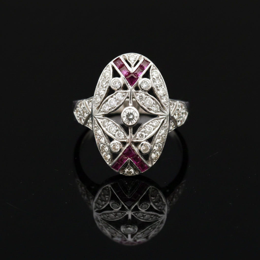 Estate jewelry — A Ruby in Open Oval Work, in White Gold, Ruby, pear cut, 0.25 cttw, SI1-SI2 clarity