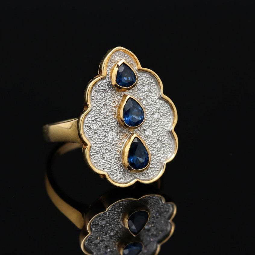 Estate jewelry — A Sapphire Line, in Two-Tone Gold, Sapphire, pear shape, 0.65 cttw (3 stones)