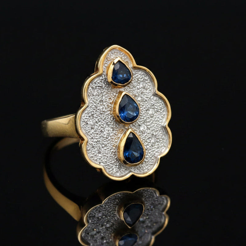 Estate jewelry — A Sapphire Line, in Two-Tone Gold, Sapphire, pear shape, 0.65 cttw (3 stones)