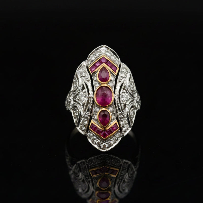 Estate jewelry — A Shield of Rubies, in Two-Tone Gold, Ruby, cabochon/pear cut, 0.70 cttw, VS2-SI1 clarity
